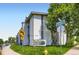 Exterior view of building with manicured lawn, mature trees and clear, blue skies at 2280 S Oswego Way # 104, Aurora, CO 80014