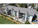 Aerial of apartment buildings with grey roofs, patios and wood fence in foreground at 2280 S Oswego Way # 104, Aurora, CO 80014