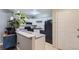 Cozy kitchen features updated countertops, black appliances, and a small dining space at 2280 S Oswego Way # 104, Aurora, CO 80014