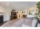 Spacious living area open to the dining and kitchen areas, with a cozy fireplace at 2280 S Oswego Way # 104, Aurora, CO 80014
