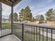 Relaxing street view from the patio, showcasing neighborhood greenery and open spaces at 2280 S Oswego Way # 104, Aurora, CO 80014