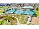 Aerial view of multiple community tennis courts with walking paths and greenery at 2280 S Oswego Way # 104, Aurora, CO 80014