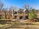 Stone home with an outdoor dining area, fire pit, and pergola perfect for entertaining at 4160 S Humboldt St, Cherry Hills Village, CO 80113