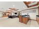 Finished basement featuring wood trim, a bar, and ample seating at 4160 S Humboldt St, Cherry Hills Village, CO 80113
