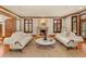 Open living room showcasing two sofas, a fireplace, and wood trim details at 4160 S Humboldt St, Cherry Hills Village, CO 80113