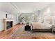Spacious main bedroom with a fireplace, sitting area, hardwood floors, and chandelier at 4160 S Humboldt St, Cherry Hills Village, CO 80113