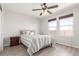 Bright bedroom features a ceiling fan, neutral walls and a comfortable queen-sized bed at 5530 Lewiston Ct, Denver, CO 80239