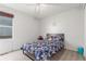 Comfortable bedroom with wood flooring, large window and decorative bedding at 5530 Lewiston Ct, Denver, CO 80239