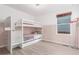 Charming bedroom with bunk beds, built in shelves, and a cozy atmosphere at 5530 Lewiston Ct, Denver, CO 80239