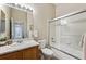Bright bathroom with oak vanity and shower-tub at 2870 W Riverwalk Cir # B, Littleton, CO 80123