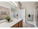 Bathroom with marble vanity and glass shower doors at 2870 W Riverwalk Cir # B, Littleton, CO 80123