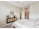 Spacious bedroom showing view into hallway and doors to other rooms at 2870 W Riverwalk Cir # B, Littleton, CO 80123