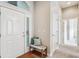 Bright entryway with hardwood floors, bench seating, and natural light at 2870 W Riverwalk Cir # B, Littleton, CO 80123