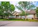 Charming one-story exterior with covered porch and well-manicured front yard at 2870 W Riverwalk Cir # B, Littleton, CO 80123