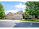Beautiful two-story townhome featuring attached garages and landscaped front yards at 2870 W Riverwalk Cir # B, Littleton, CO 80123