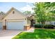 Charming home with a two-car garage, manicured lawn and mature shade tree at 2870 W Riverwalk Cir # B, Littleton, CO 80123