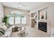 Bright living room featuring a fireplace, large windows and a comfortable sofa at 2870 W Riverwalk Cir # B, Littleton, CO 80123