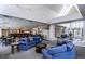 Bright lounge area with bar, ample seating, and abundant natural light from multiple windows and skylight at 2870 W Riverwalk Cir # B, Littleton, CO 80123