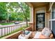 Comfortable patio with seating, brick accents, and views of the street and landscaping at 2870 W Riverwalk Cir # B, Littleton, CO 80123