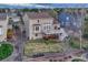 An aerial view of the home's backyard with a well-maintained lawn and a patio, perfect for outdoor relaxation at 6973 Daventry Pl, Castle Pines, CO 80108