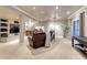 The finished basement includes a wet bar, plush seating, and access to the backyard at 6973 Daventry Pl, Castle Pines, CO 80108