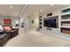 Spacious finished basement with built-in shelving, neutral carpet, and recessed lighting at 6973 Daventry Pl, Castle Pines, CO 80108