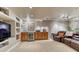 Finished basement with a bar, entertainment area, and comfortable seating, perfect for relaxation and gatherings at 6973 Daventry Pl, Castle Pines, CO 80108