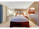 Inviting bedroom featuring a large bed, recessed lights, and neutral color palette at 6973 Daventry Pl, Castle Pines, CO 80108
