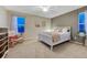 Cozy bedroom with neutral walls, plush bedding, and bright windows creating a relaxing retreat at 6973 Daventry Pl, Castle Pines, CO 80108