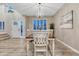 Dining room with modern chandelier and natural light at 6973 Daventry Pl, Castle Pines, CO 80108