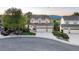 Charming two-story home with a well-manicured lawn and a three-car garage at 6973 Daventry Pl, Castle Pines, CO 80108