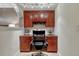 Home office with a built-in desk, wooden cabinets, and a comfortable chair at 6973 Daventry Pl, Castle Pines, CO 80108