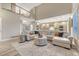 Open-concept living room with high ceilings and plenty of natural light at 6973 Daventry Pl, Castle Pines, CO 80108