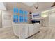 Spacious living room with fireplace, large windows, and comfortable seating at 6973 Daventry Pl, Castle Pines, CO 80108