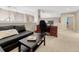 Cozy loft space with dark furniture, decorative details, and easy access to other areas of the home at 6973 Daventry Pl, Castle Pines, CO 80108