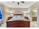 Inviting main bedroom with a bed, carpeting, lamps, and natural light at 6973 Daventry Pl, Castle Pines, CO 80108