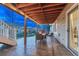Covered patio with a dining table set and chairs, perfect for outdoor dining at 6973 Daventry Pl, Castle Pines, CO 80108