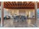 Covered patio with dining and lounge seating for relaxing at 6973 Daventry Pl, Castle Pines, CO 80108