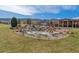 Scenic community view featuring well-maintained landscaping, rock features, and residential buildings at 9836 W Freiburg Dr # 4E, Littleton, CO 80127