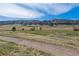 Picturesque view of the surrounding community with open spaces and rolling hills enhancing the natural setting at 9836 W Freiburg Dr # 4E, Littleton, CO 80127