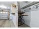 Garage interior showcasing storage solutions, including shelving, cabinets, and space for bikes at 9836 W Freiburg Dr # 4E, Littleton, CO 80127