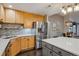 Contemporary kitchen with stainless steel appliances, a center island, and an open design that flows into the dining area at 9836 W Freiburg Dr # 4E, Littleton, CO 80127