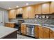 Functional kitchen featuring stainless steel appliances, updated cabinetry, and plenty of counter space at 9836 W Freiburg Dr # 4E, Littleton, CO 80127