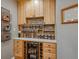Pantry with custom shelving, a beverage cooler, and organized storage for food and drinks at 9836 W Freiburg Dr # 4E, Littleton, CO 80127