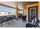 Expansive covered patio featuring multiple seating areas for versatile outdoor enjoyment at 9836 W Freiburg Dr # 4E, Littleton, CO 80127