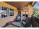 Large covered patio offering a variety of seating options and scenic views at 9836 W Freiburg Dr # 4E, Littleton, CO 80127