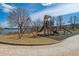 Community playground with modern equipment and a climbing structure offers fun for all ages with serene lake views at 9836 W Freiburg Dr # 4E, Littleton, CO 80127