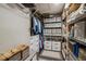 Organized walk-in closet with shelving units, clothing rods, drawers, and a variety of storage options at 9836 W Freiburg Dr # 4E, Littleton, CO 80127