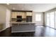 Contemporary kitchen featuring stainless steel appliances, sleek countertops, a stylish island, and abundant natural light at 3427 Cade Ct, Castle Rock, CO 80104