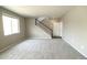 Inviting living room featuring a staircase, neutral walls, plush carpeting and a bright atmosphere for comfortable living at 3427 Cade Ct, Castle Rock, CO 80104